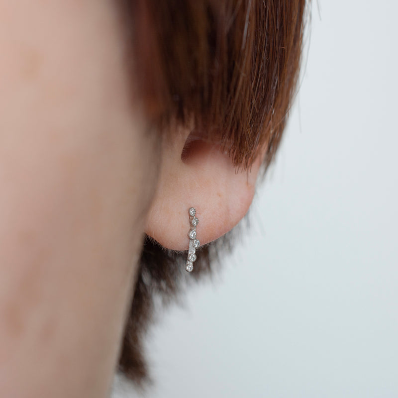 spread diamond stud earrings