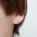 spread diamond stud earrings