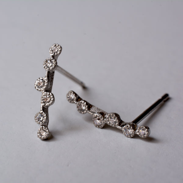 spread diamond stud earrings